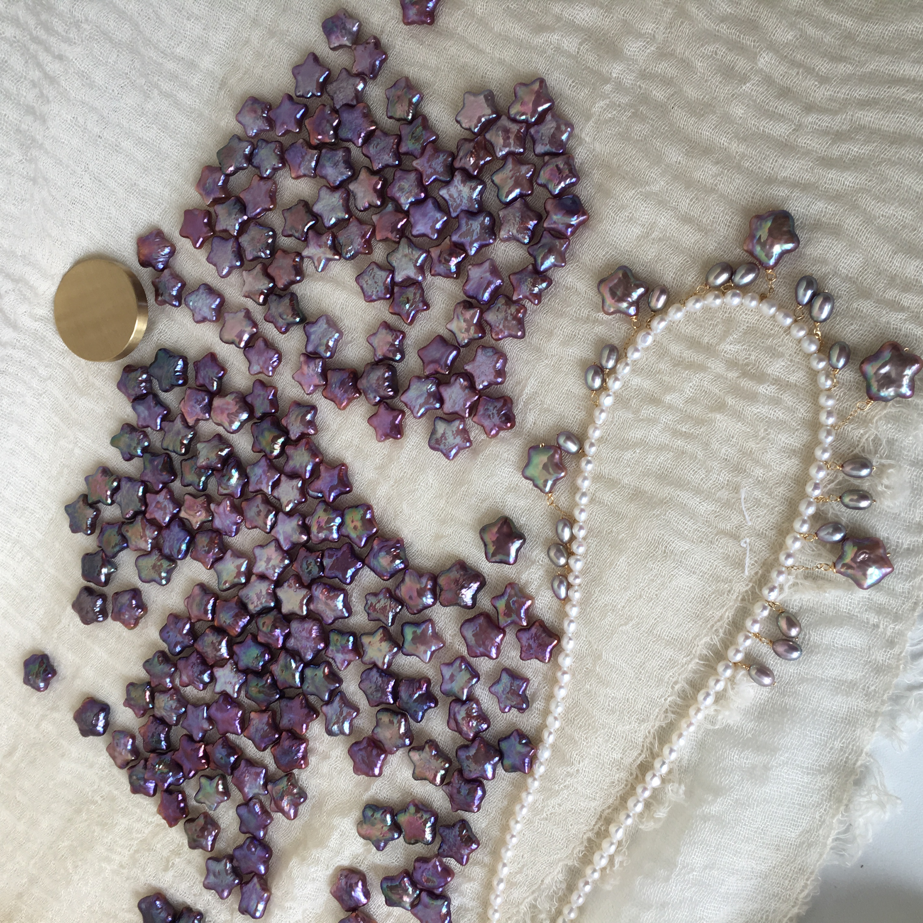 Wholesale star shaped pearls displayed in bulk quantities for jewelry suppliers and retailers