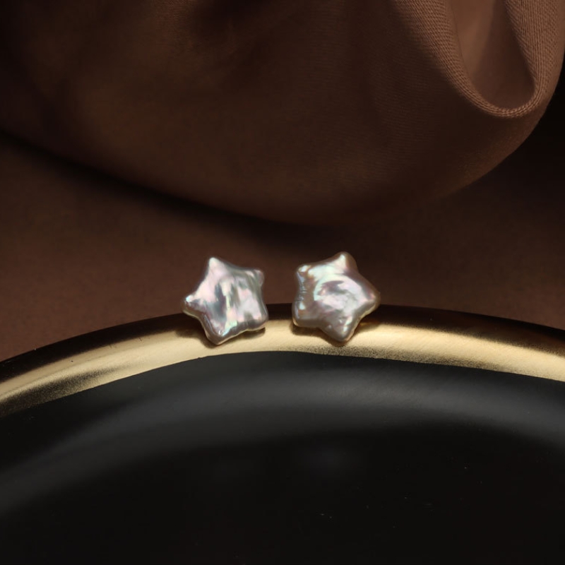 Real natural pearls displaying lustrous nacre coating formed inside ocean mollusks